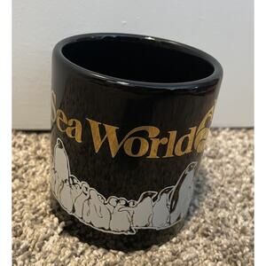 Vintage 1985 Sea World Coffee Cup Mug Penguins & Shamu Black Gold Ceramic